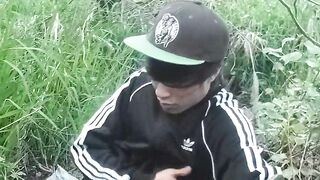 Cute Oriental homo twink in a ebony-and-white adidas tracksuit and Campus sneakers masturbates and cums outdoors