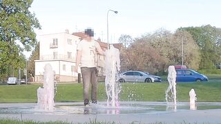 Walking with garments on throughout a fountain and get fully juicy