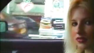 Large boobed blond gives oral-sex in car