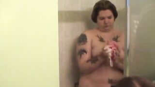 Tattooed obese hottie disrobes to wash her boobs and twat in the shower