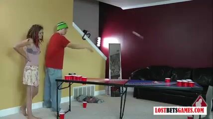 3 cuties and one dude play a game of undress beer pong