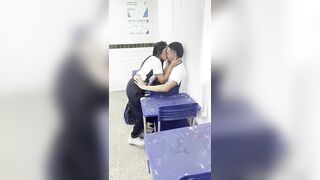 A youthful eighteen-year-old beauty giving head to her ally in the classroom.