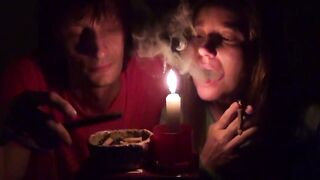 Pair smoke next to candle