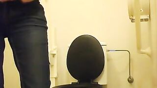 Woman squats over lavatory to pee