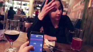 I took control of my stepsister's sex toy in the bar and brought her to climax.