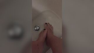 Playing with my feet in the bathroom tub