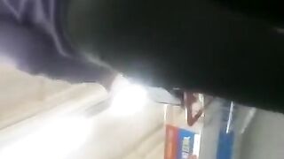 Woman in ebony leggings in supermarket
