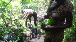 two Afro tribe angel having enjoyment with the village chief in the centre of the forrest