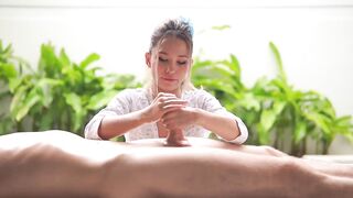A tiny Oriental woman massages a large ramrod