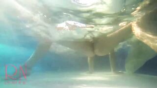 Elegant and supple chick, swimming underwater in the outdoor swimming pool. three two