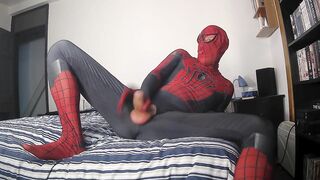 Spiderman jerking off his vertical shlong and cumming with a large spunk fountain spurting cum over himself