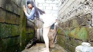 Peeing from behind onto the wall after watching parade