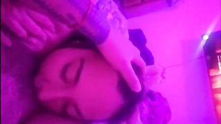 eating honey underneath the soft pink light