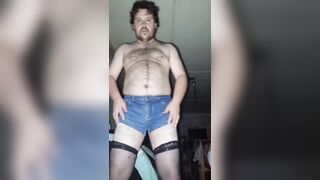 A chubby-assed homosexual dude works out his dick in ripped denim shorts and ebony nylons!