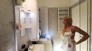 Hot girl cute blond sexually excited beauty in pink pants and with a satin nightie does the baths routine previous to gonna the couch